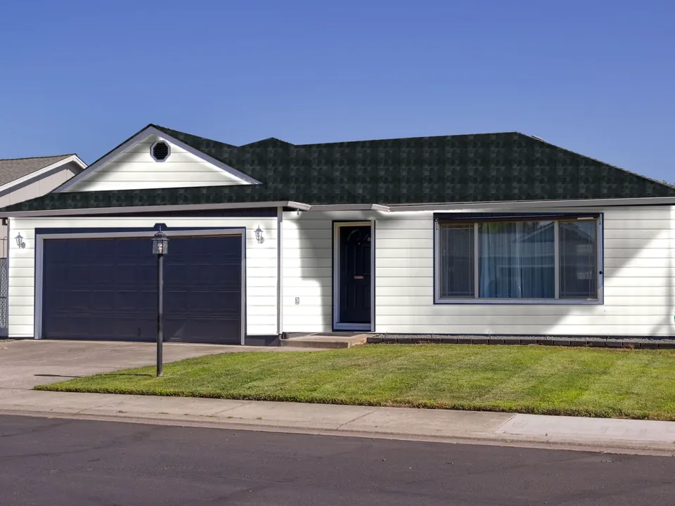 The same sample home with the Omaha Modern look: A black roof over crisp white lap siding.